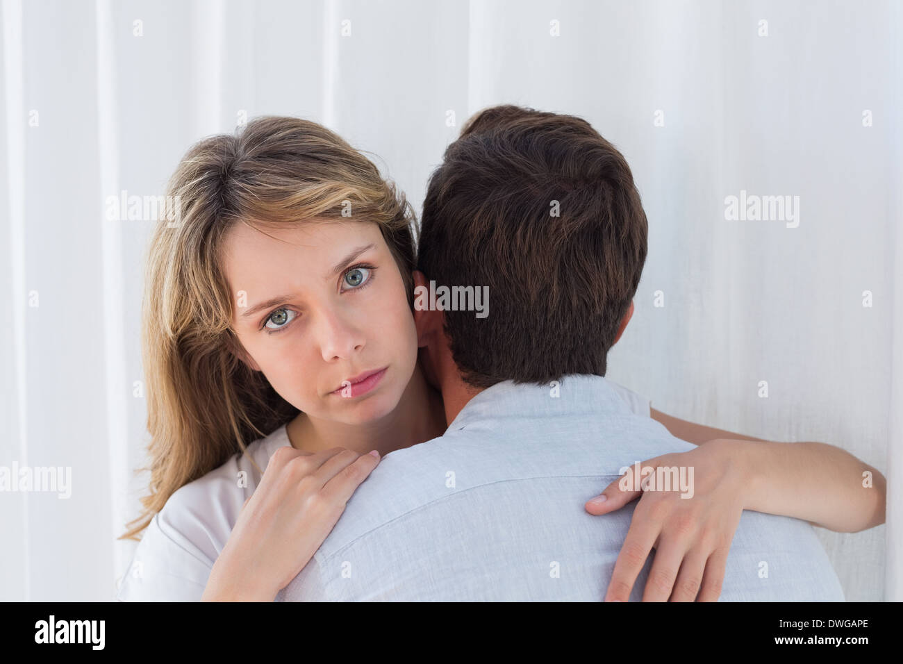 Close-up of a loving woman embracing man Stock Photo - Alamy