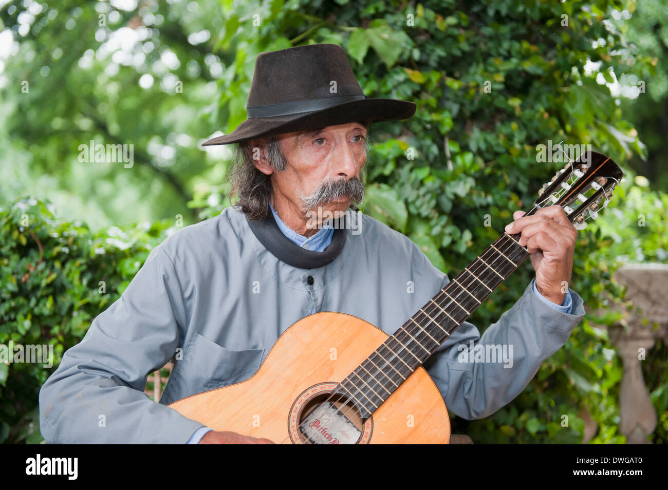 Gaucho playing guitar, San Antonio de Areco Stock Photo
