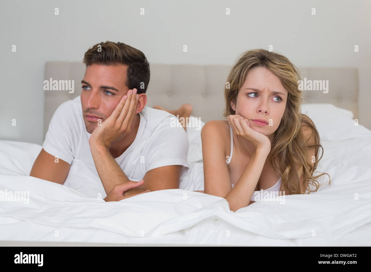 Couple not talking after an argument in bed Stock Photo