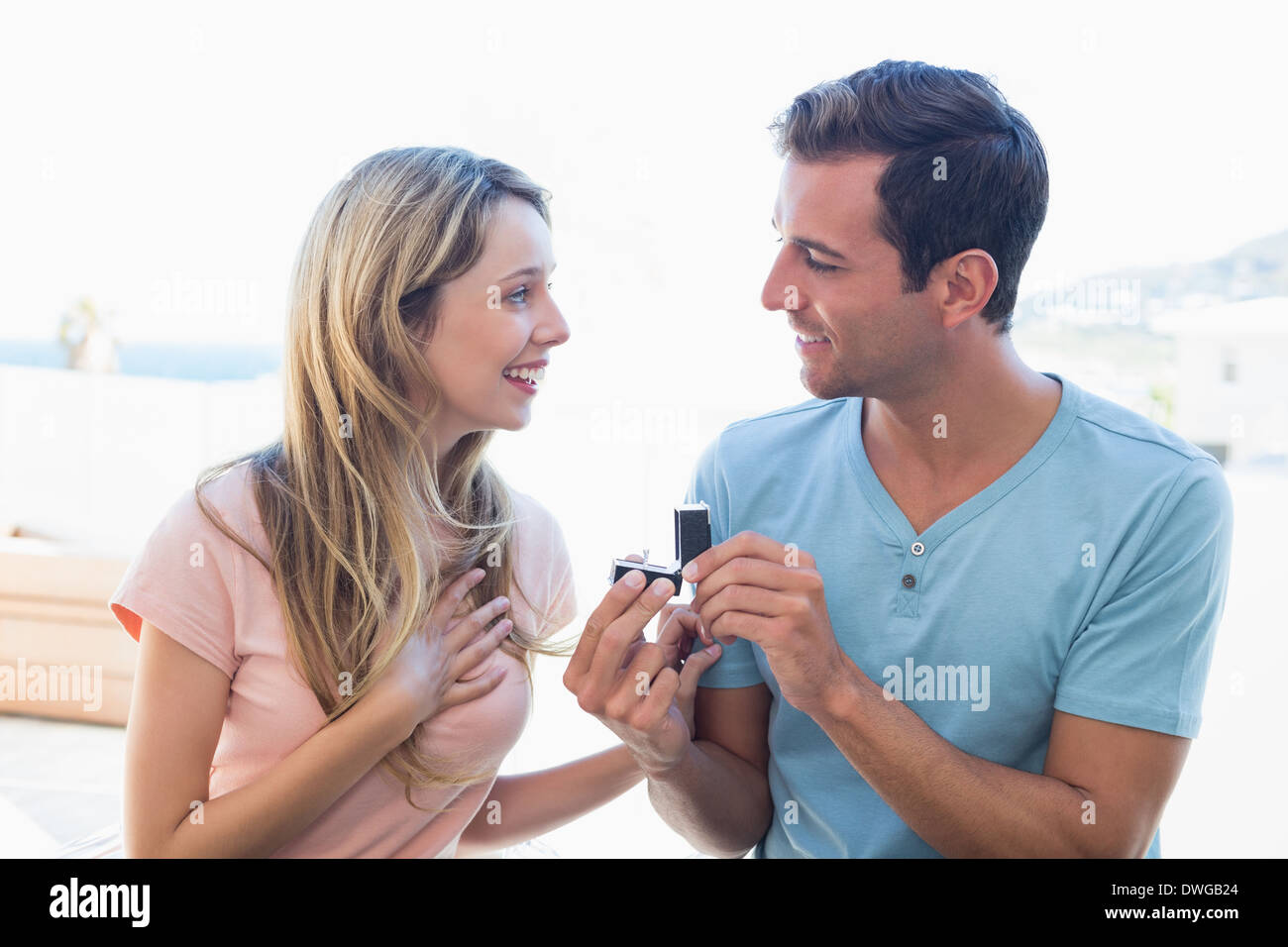 Man surprising beautiful woman with a wedding ring Stock Photo