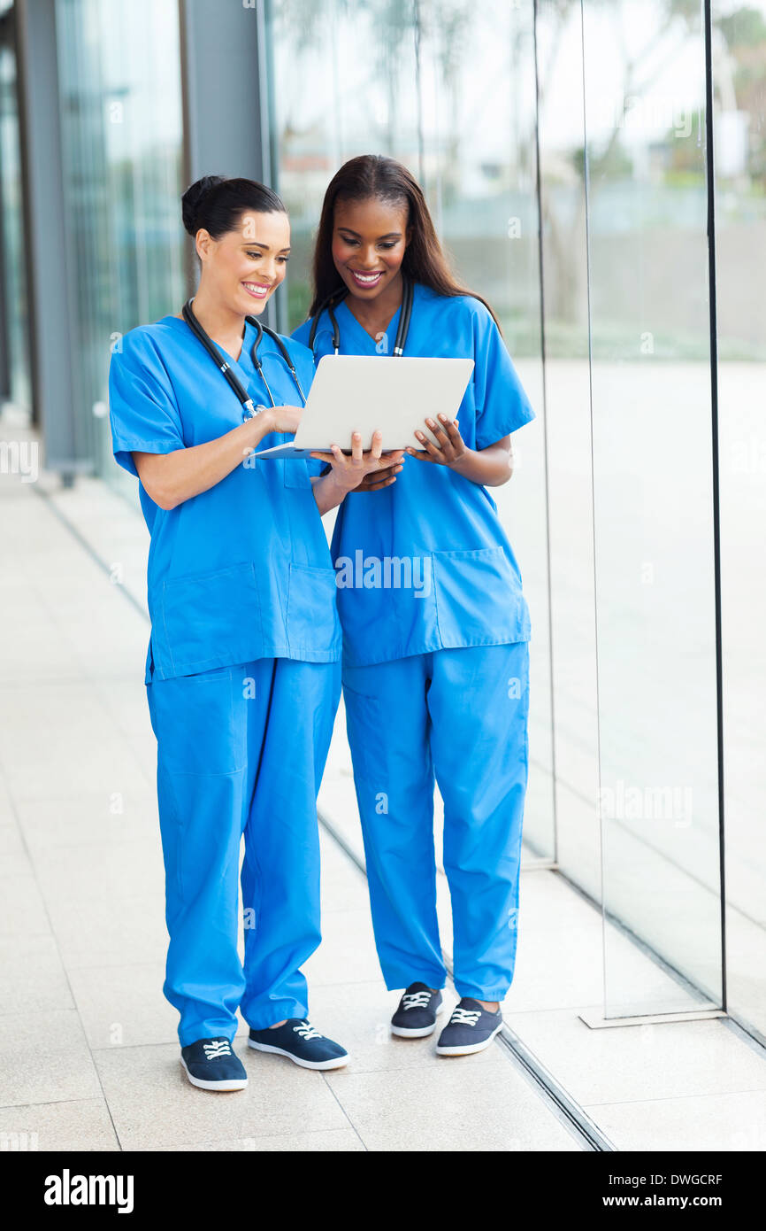 two beautiful female healthcare workers using laptop Stock Photo