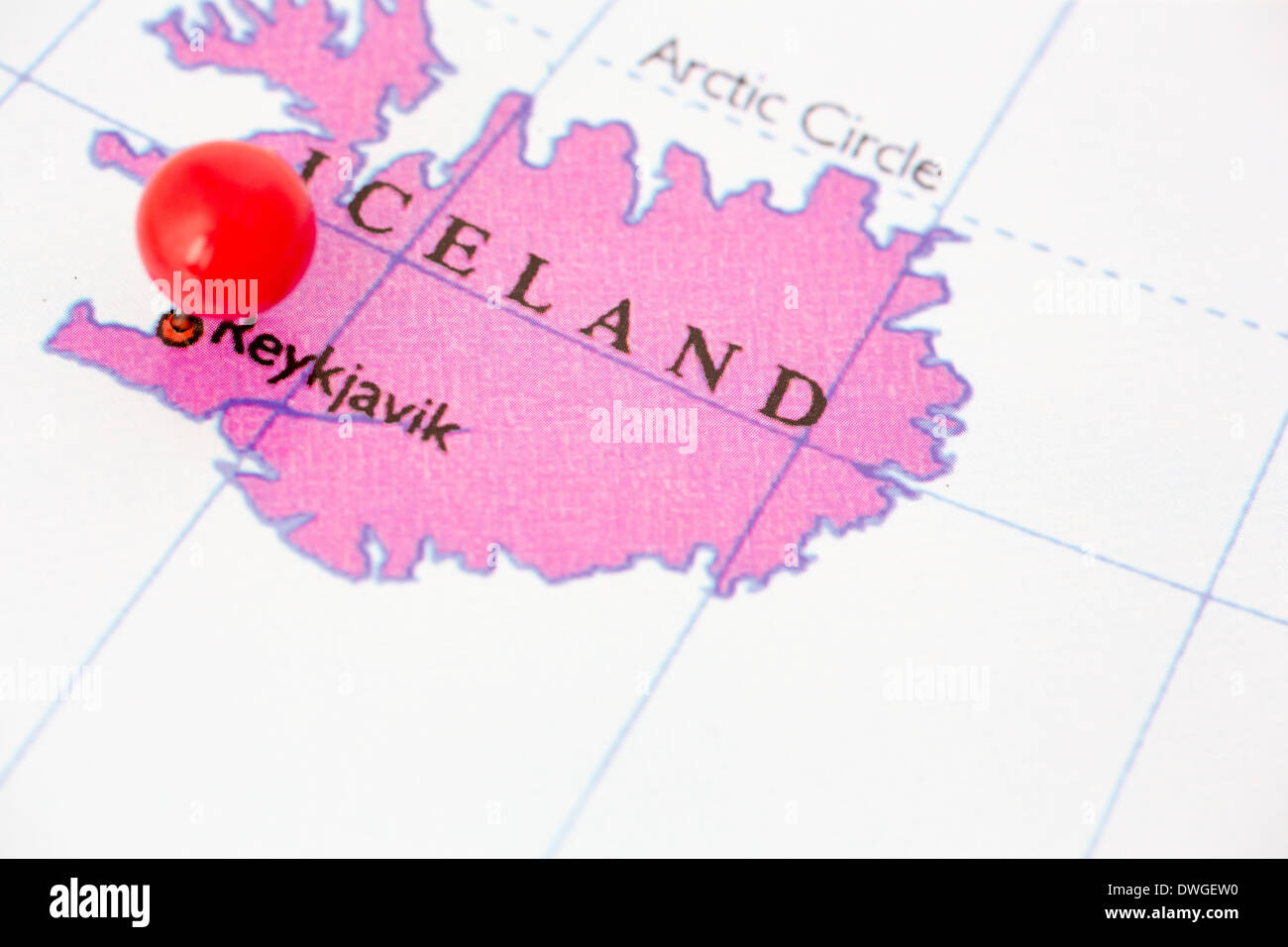 Round red thumb tack pinched through city of Reykjavik on Iceland map. Part of collection covering all major capitals of Europe. Stock Photo