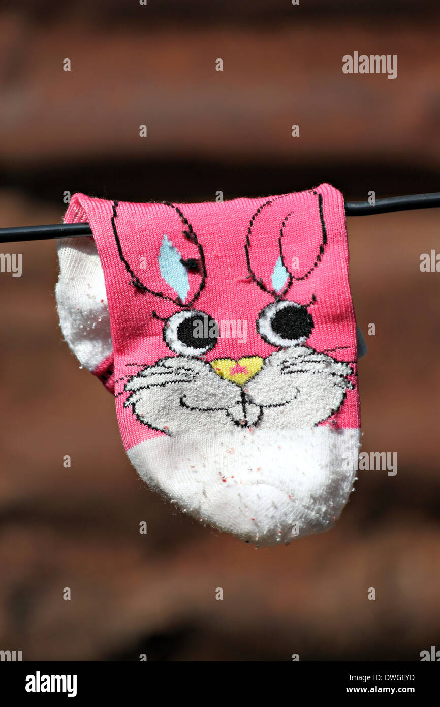 The Old socks to airing after washing. Stock Photo