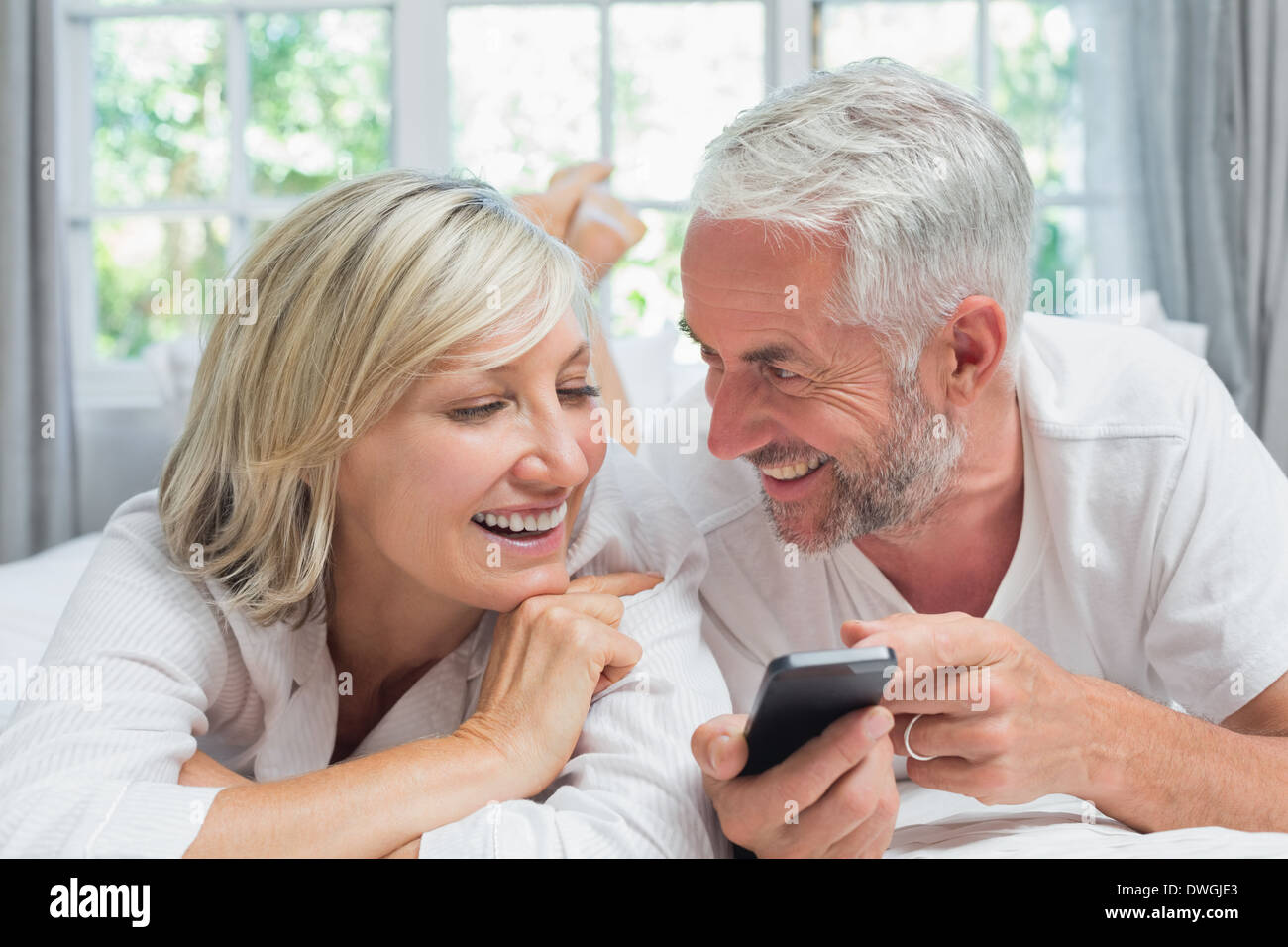Cheerful mature couple reading hi-res stock photography and images - Alamy