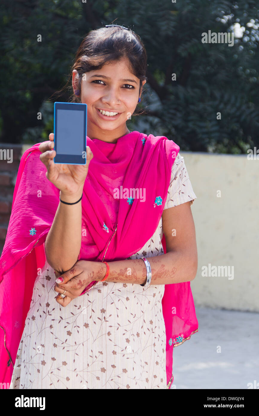 Indian rural girl showing mobile hires stock photography and images