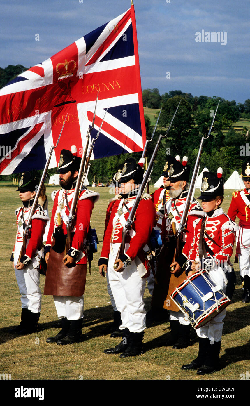 British Foot Soldiers of Waterloo, 1815, Napoleonic and Peninsula War troops, as deployed at the Battle of Waterloo, Union Jack Flag, historical re-enactment army soldier uniform uniforms England UK Stock Photo
