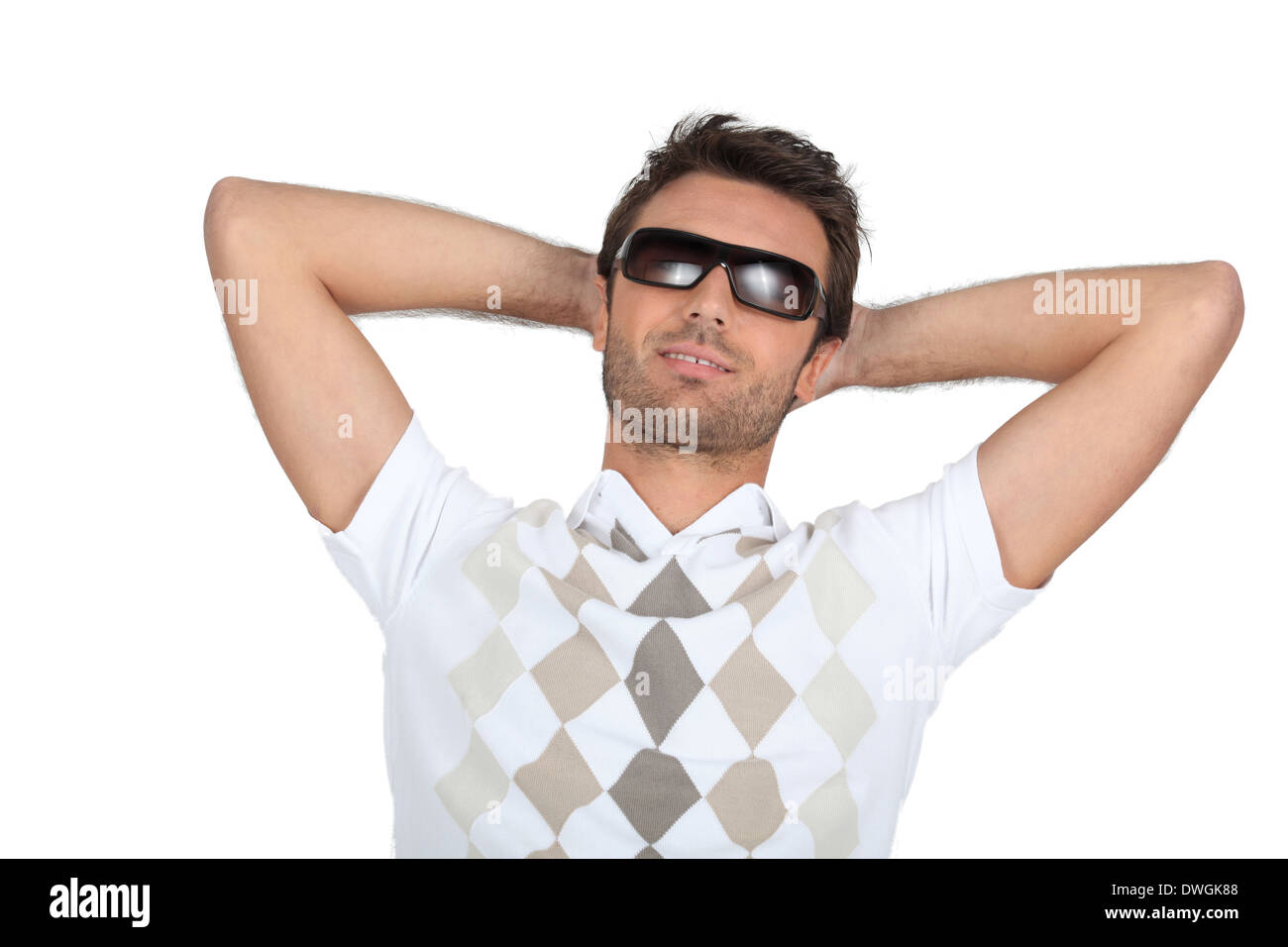 Man wearing sunglasses with his hands behind his neck Stock Photo - Alamy