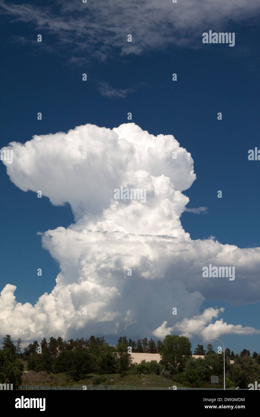 Thunderhead or cumulonimbus cloud forming on a clear day Stock Photo