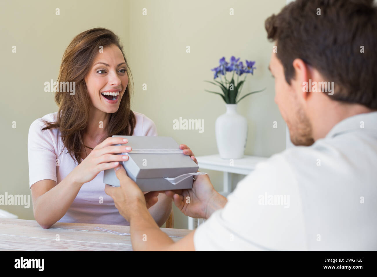 Giving A Box Woman taking gift box hi-res stock photography and images - Alamy