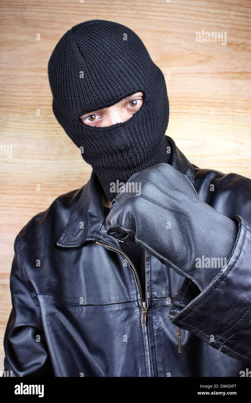 Evil criminal men in a black mask Stock Photo - Alamy