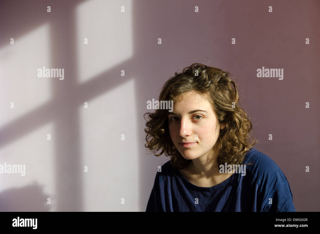 Woman young curls portrait hi-res stock photography and images - Alamy