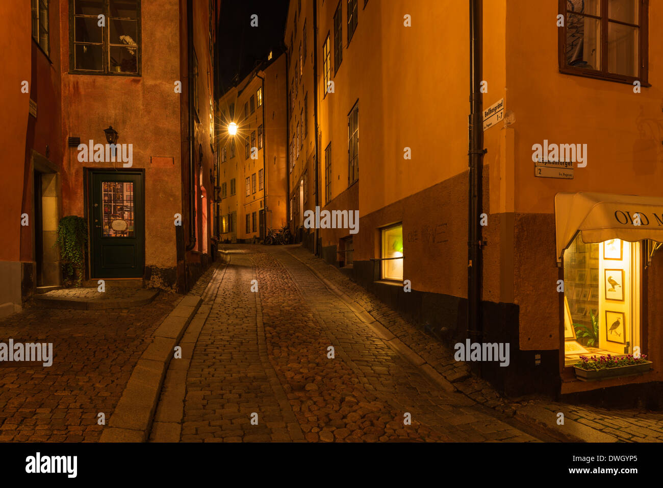 Evening view of Bollhusgränd, a narrow cobbled lane in , Gamla Stan, the old town of Stockholm, Sweden. Stock Photo
