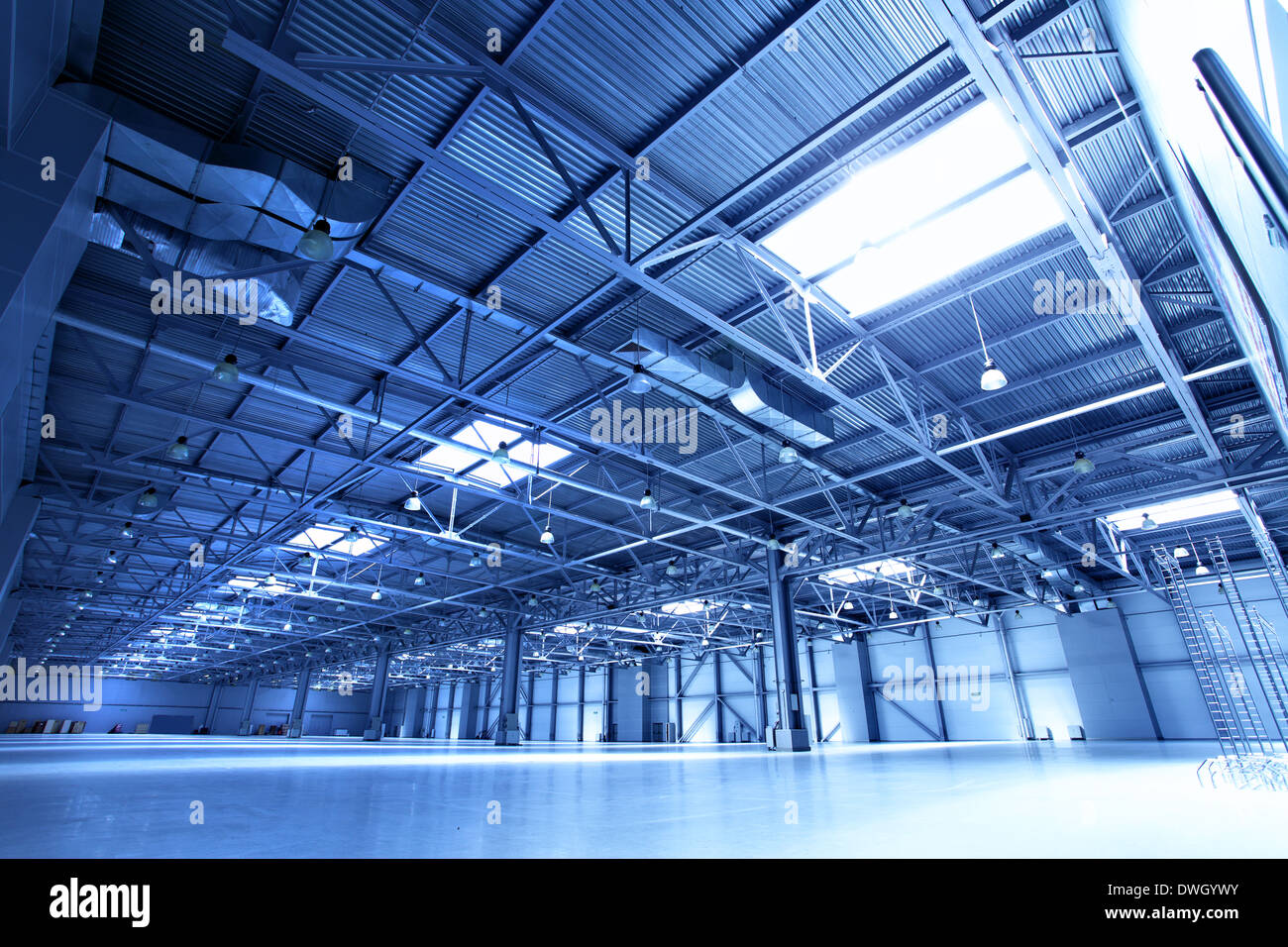 Empty warehouse toned in the blue color Stock Photo