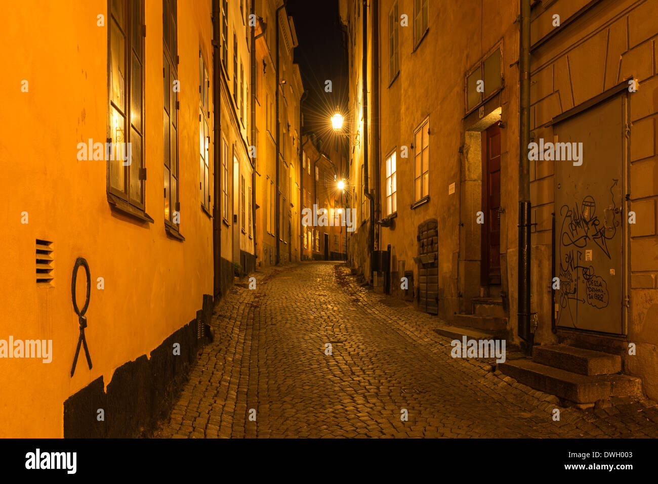 Evening view of Baggensgatan, a narrow cobbled lane in Gamla Stan, the old town of Stockholm, Sweden. Stock Photo