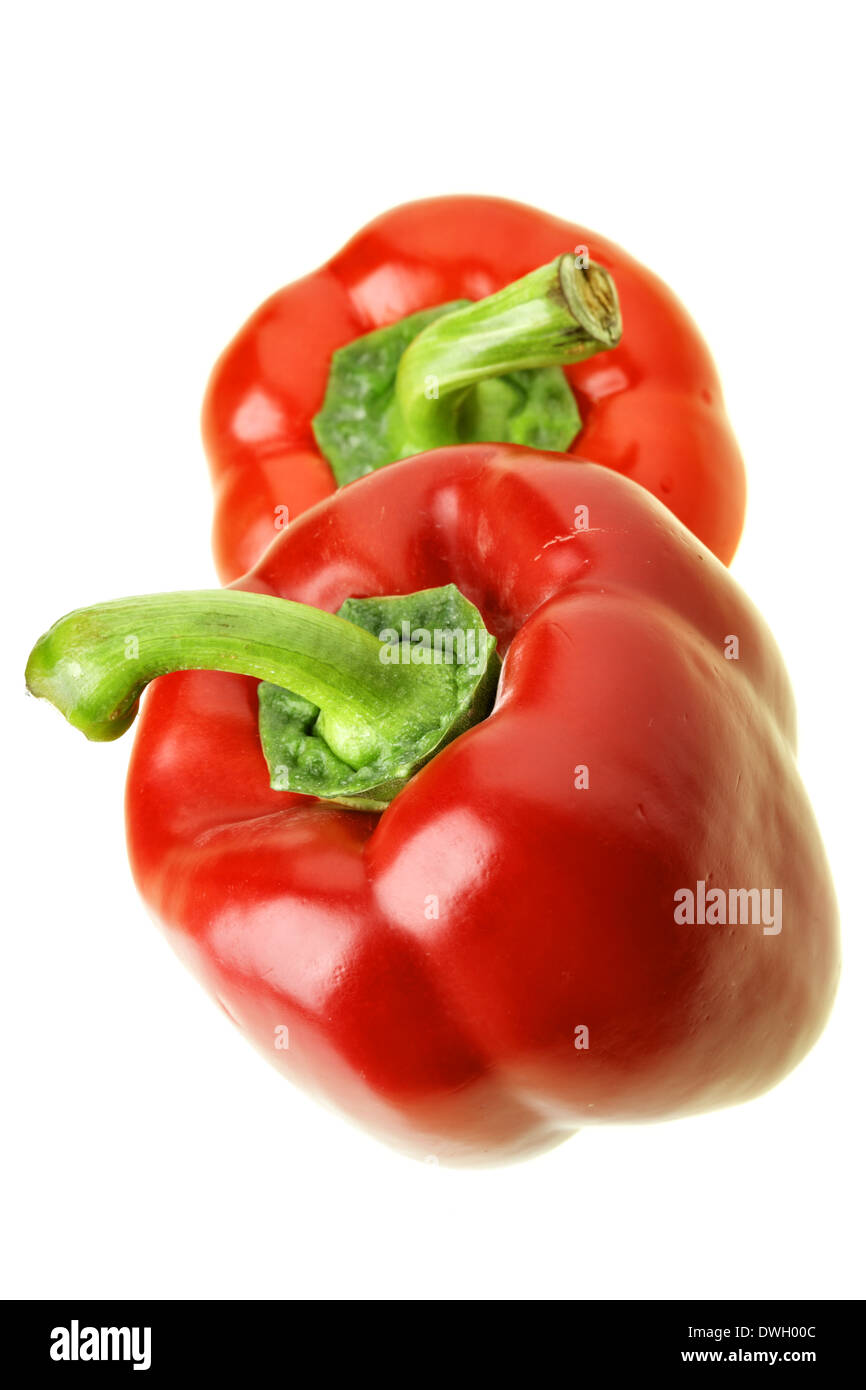 Two red sweet peppers isolated over white background Stock Photo - Alamy