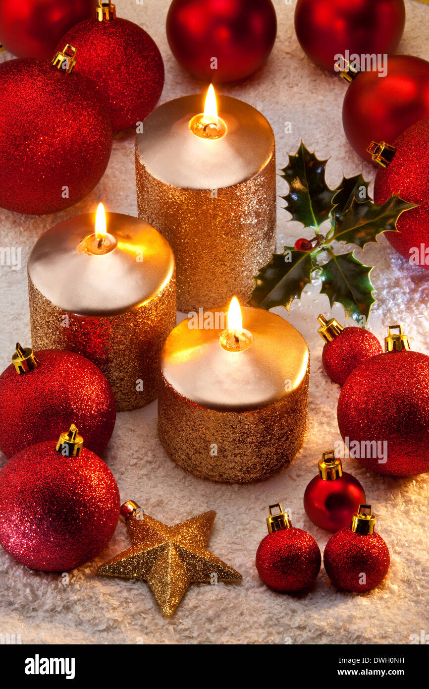 Christmas decorations and festive candles Stock Photo - Alamy