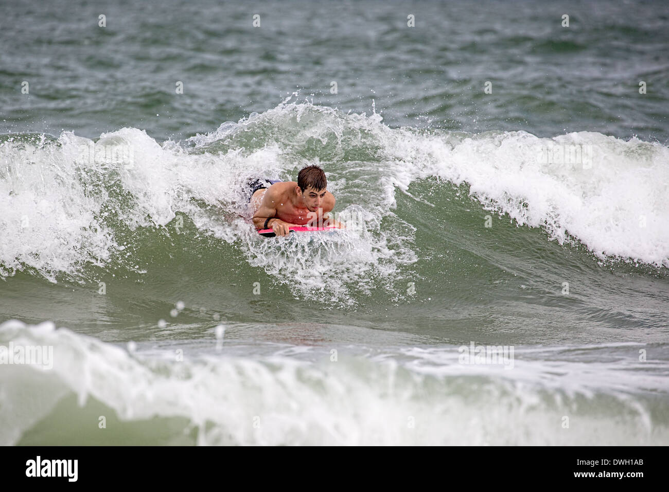 https://c8.alamy.com/comp/DWH1AB/teen-boy-boogie-boarder-on-south-carolina-wave-DWH1AB.jpg