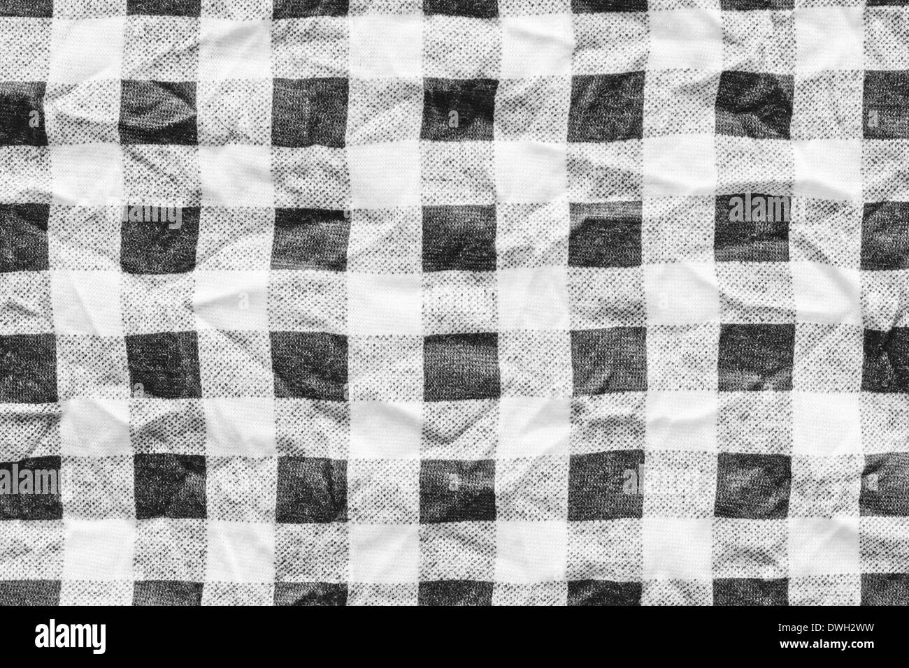 Crumpled black and white checked cloth as a background Stock Photo