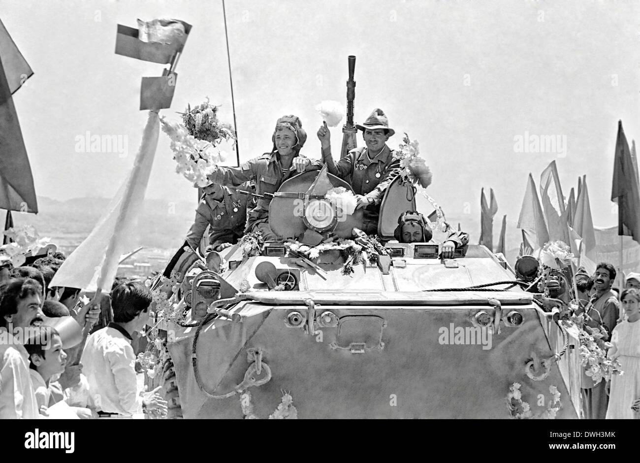 A convoy of Soviet soldiers arrive to cheering crowds after their arrival in Kabul from the eastern city of Jalalabad as the beginning of the Soviet withdrawal May 15, 1988 in Kabul Afghanistan. Stock Photo