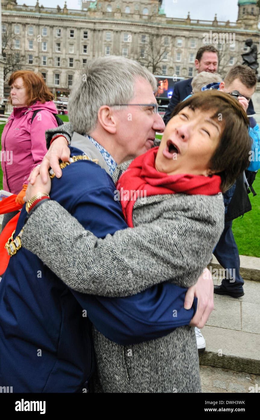 Belfast, Northern Ireland. 8 Mar 2014 - Lord Mayor Mairtin O Muilleoir (Sinn Fein) gives Anna Lo (Alliance) a hug Credit:  Stephen Barnes/Alamy Live News Stock Photo