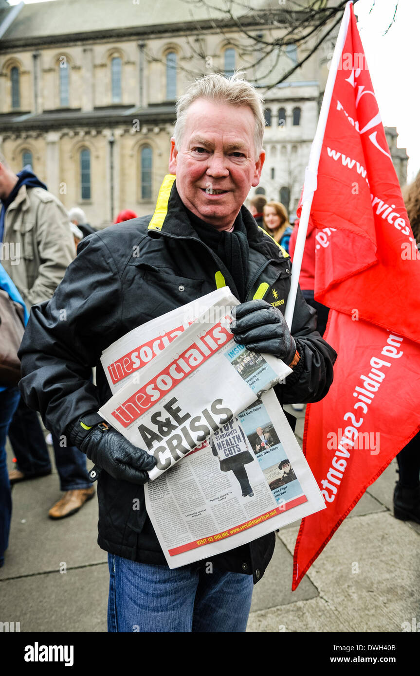 Belfast, Northern Ireland. 8 Mar 2014 - A man sells copies of 'The Socialist' at a trade union rally. Credit:  Stephen Barnes/Alamy Live News Stock Photo