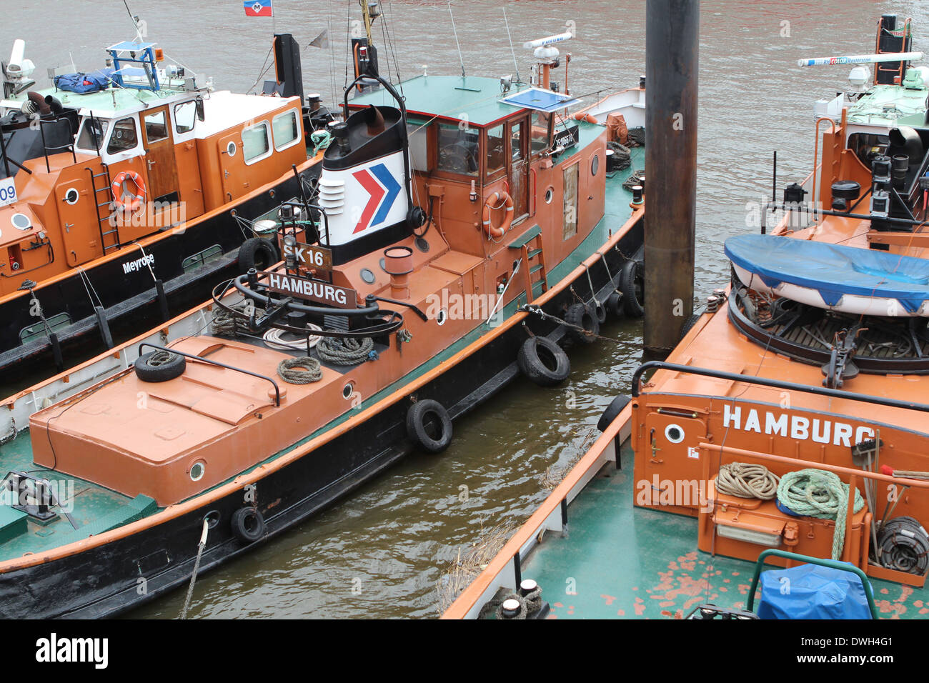 Tugs waiting to move larger vessels into the harbour of Hamburg Stock Photo