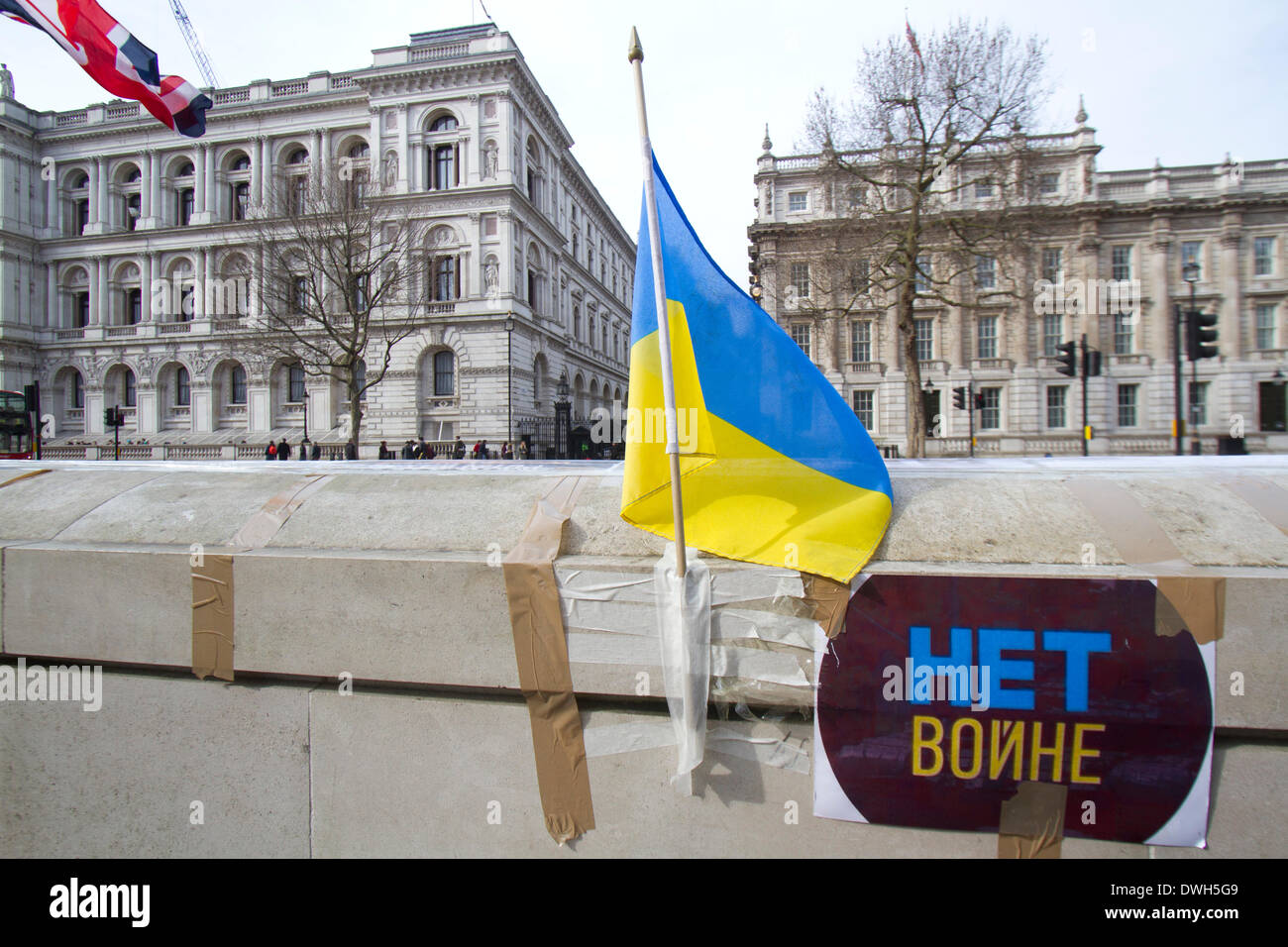 Westminster London ,UK. 8th March 2014. Ukrainian protesters continue to hold a 24hour shift protest outside Downing Street with placards following the Russian military intervention in the Crimea demanding on the British Government to keep its promises on the Budapest memorandum on Security Assurances signed in 1994.The Memorandum included security assurances against threats or use of force against the territorial integrity or political independence of Ukraine and as a result Ukraine gave up its stockpile of Nuclear weapons between 1994 and 1996. Credit:  amer ghazzal/Alamy Live News Stock Photo