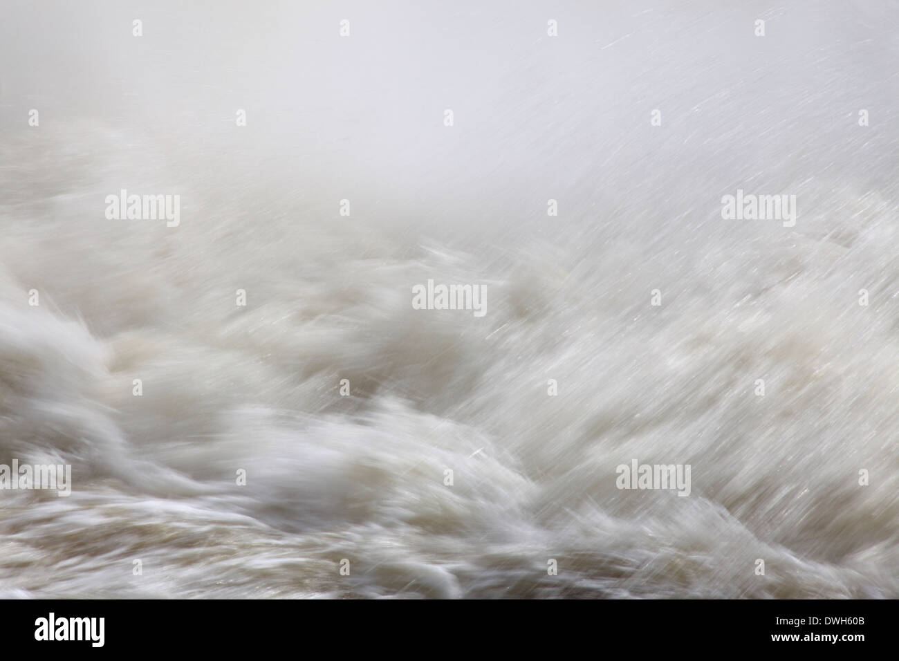 Gushing water and splashing waves in a whitewater river. Stock Photo