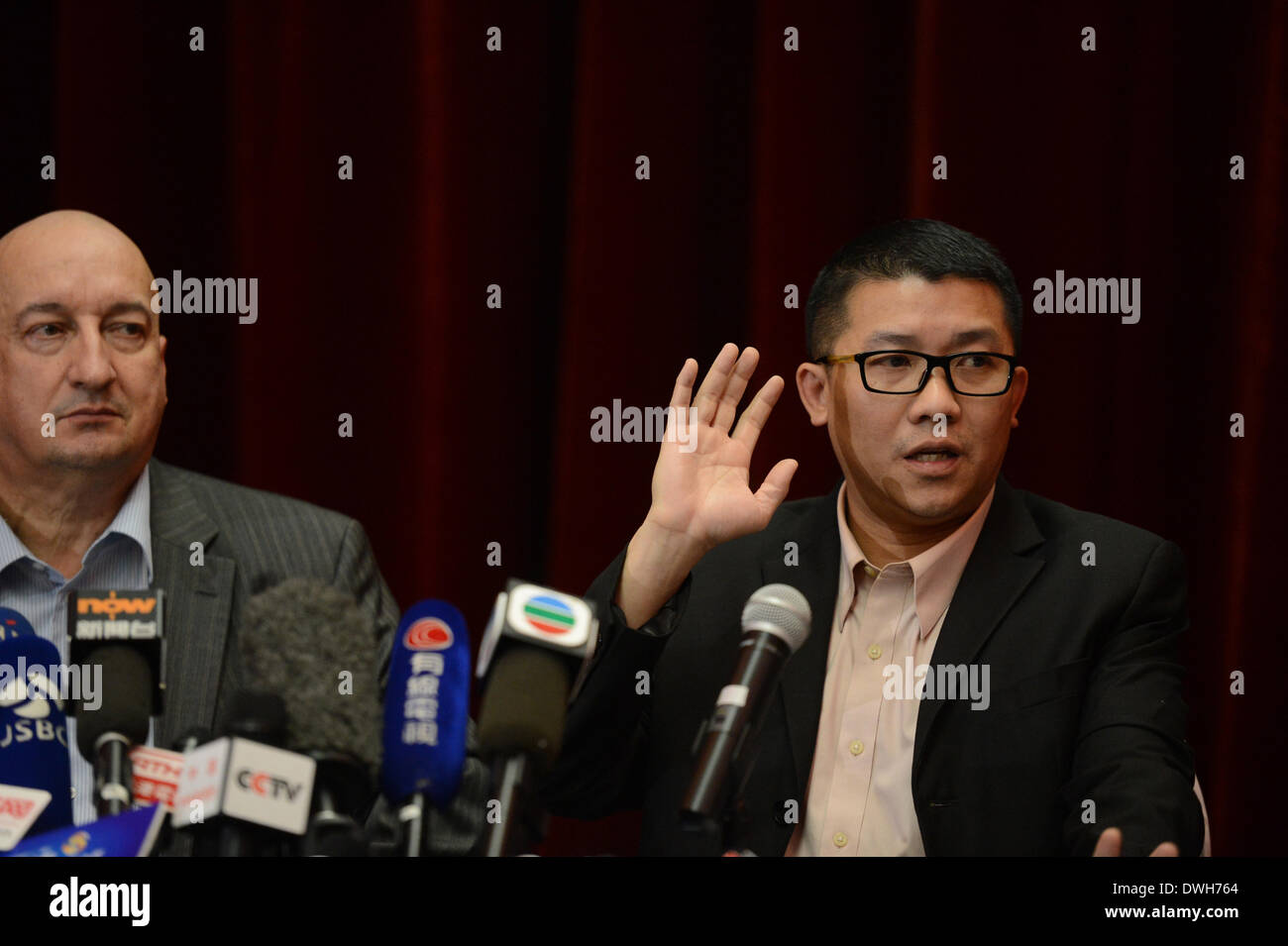 Beijing, China. 9th Mar, 2014. Representatives of the Malaysia Airlines listen to the media during the press conference in Beijing on missing flight MH 370 on March 9, 2014. Credit:  Jiang Kehong/Xinhua/Alamy Live News Stock Photo