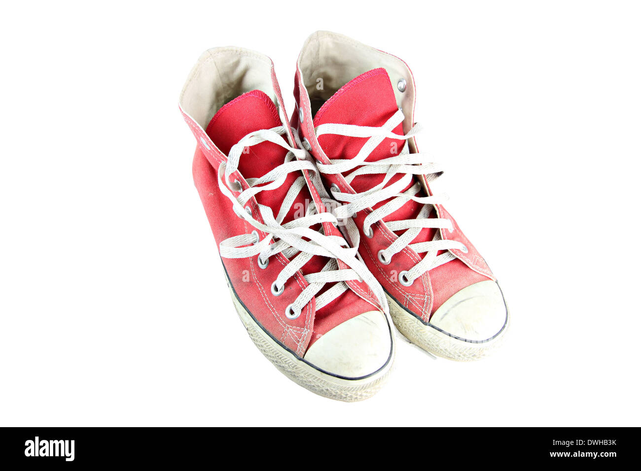 Dirty red sneaker isolated on white background Stock Photo - Alamy