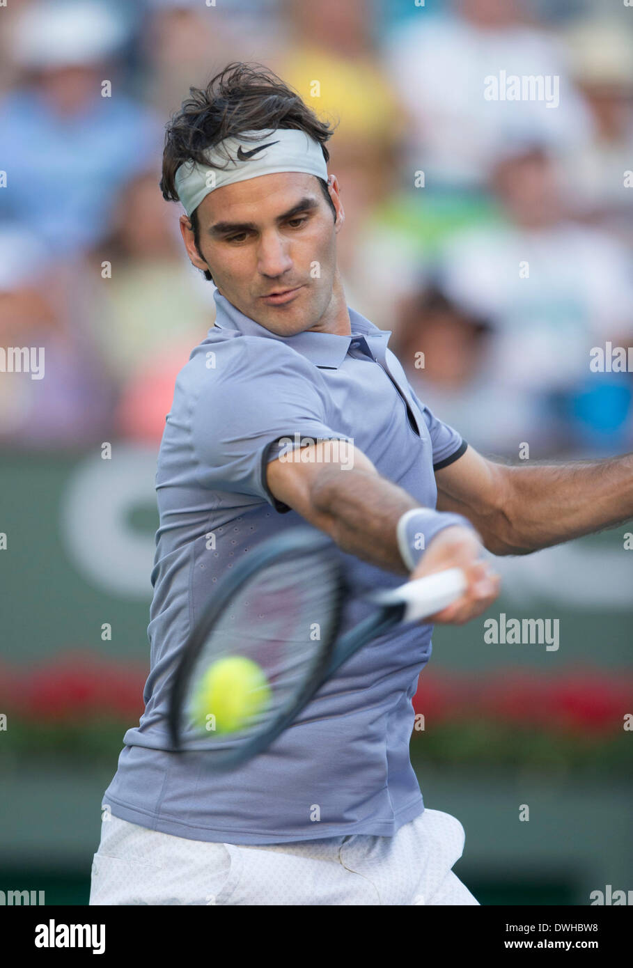 Indiana Wells, USA. 8th Mar, 2014. Roger Federer of Switzerland hits a return to Paul-Henri Mathieu of France during the BNP Paribas Open at Indian Wells Tennis Garden in Indian Wells, the United States, on March 8, 2014. Federer won 2-0. © Yang Lei/Xinhua/Alamy Live News Stock Photo