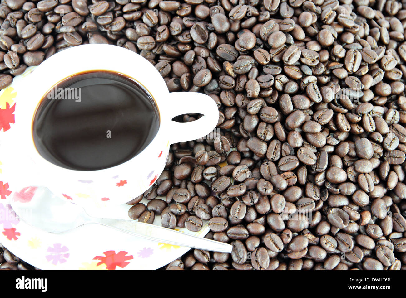 Coffee beans and white Cup of background Stock Photo - Alamy