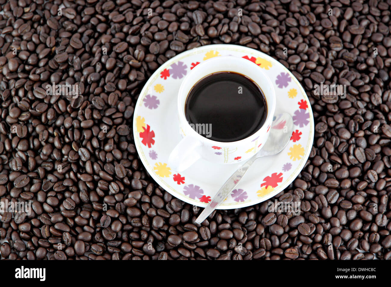 Coffee beans and white Cup of background Stock Photo - Alamy