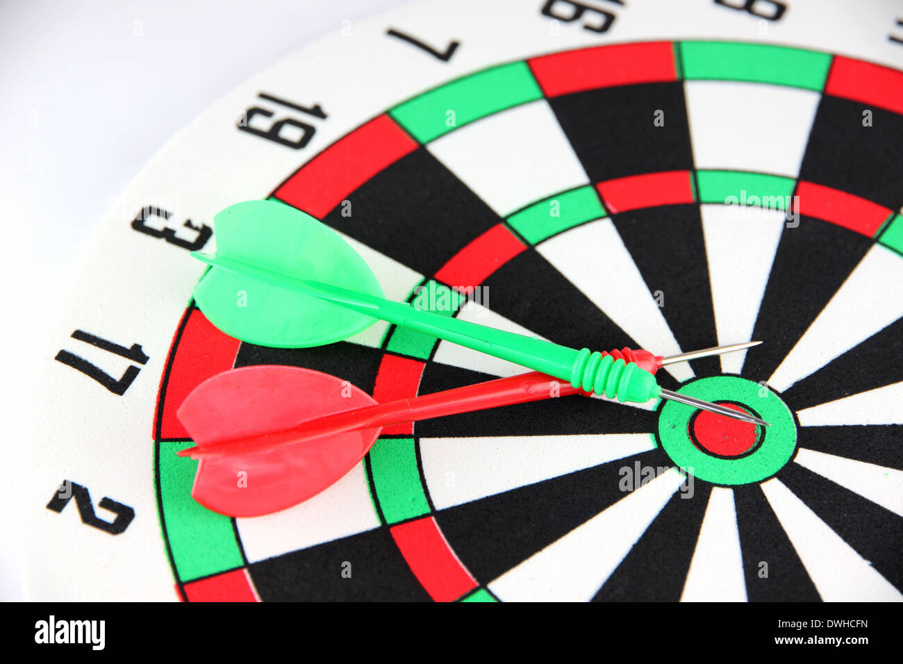 Green and Red Darts on Target Stock Photo Alamy