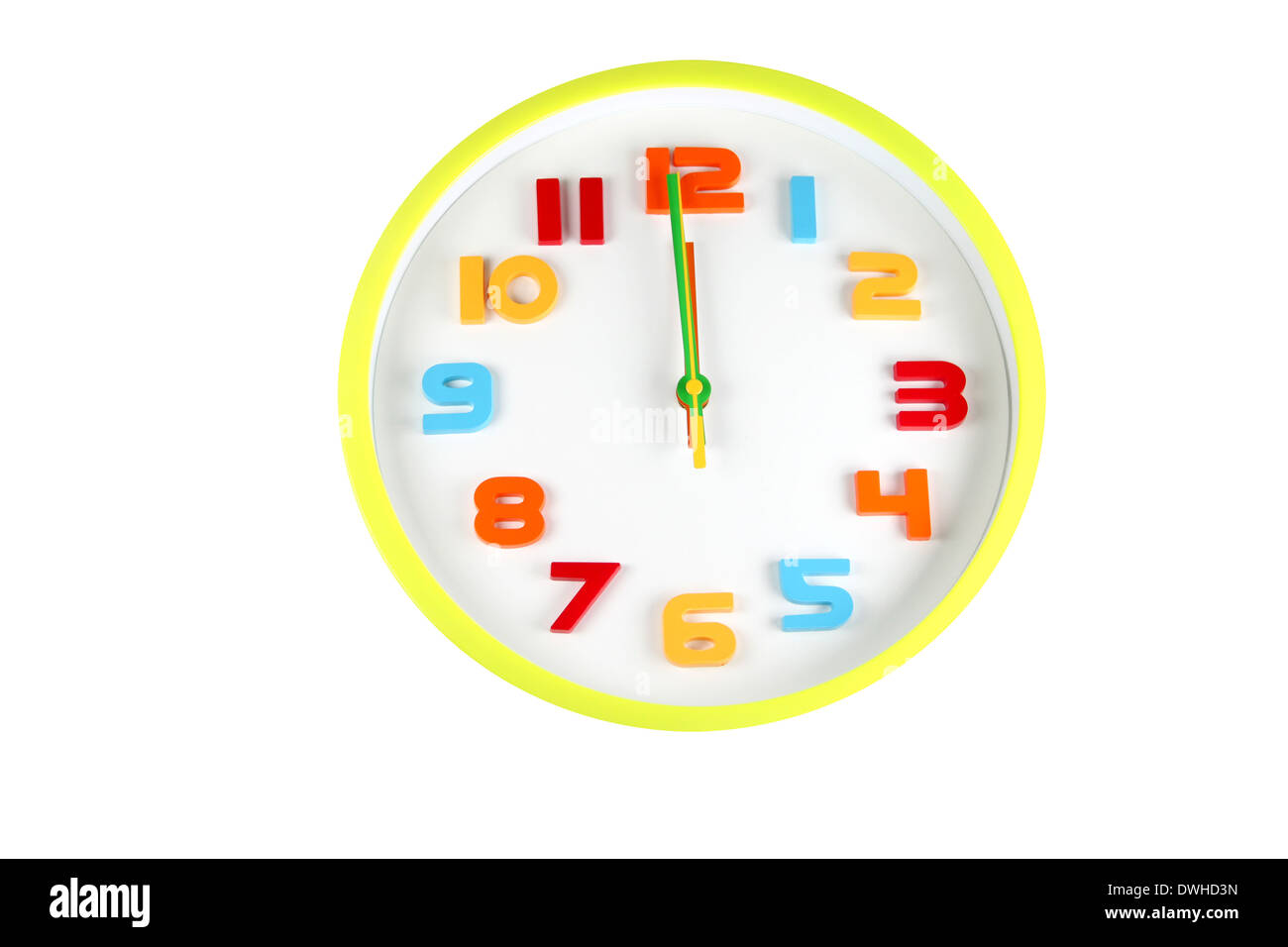 Colorful clock in telling time of Twelve o'clock on white background. Stock Photo
