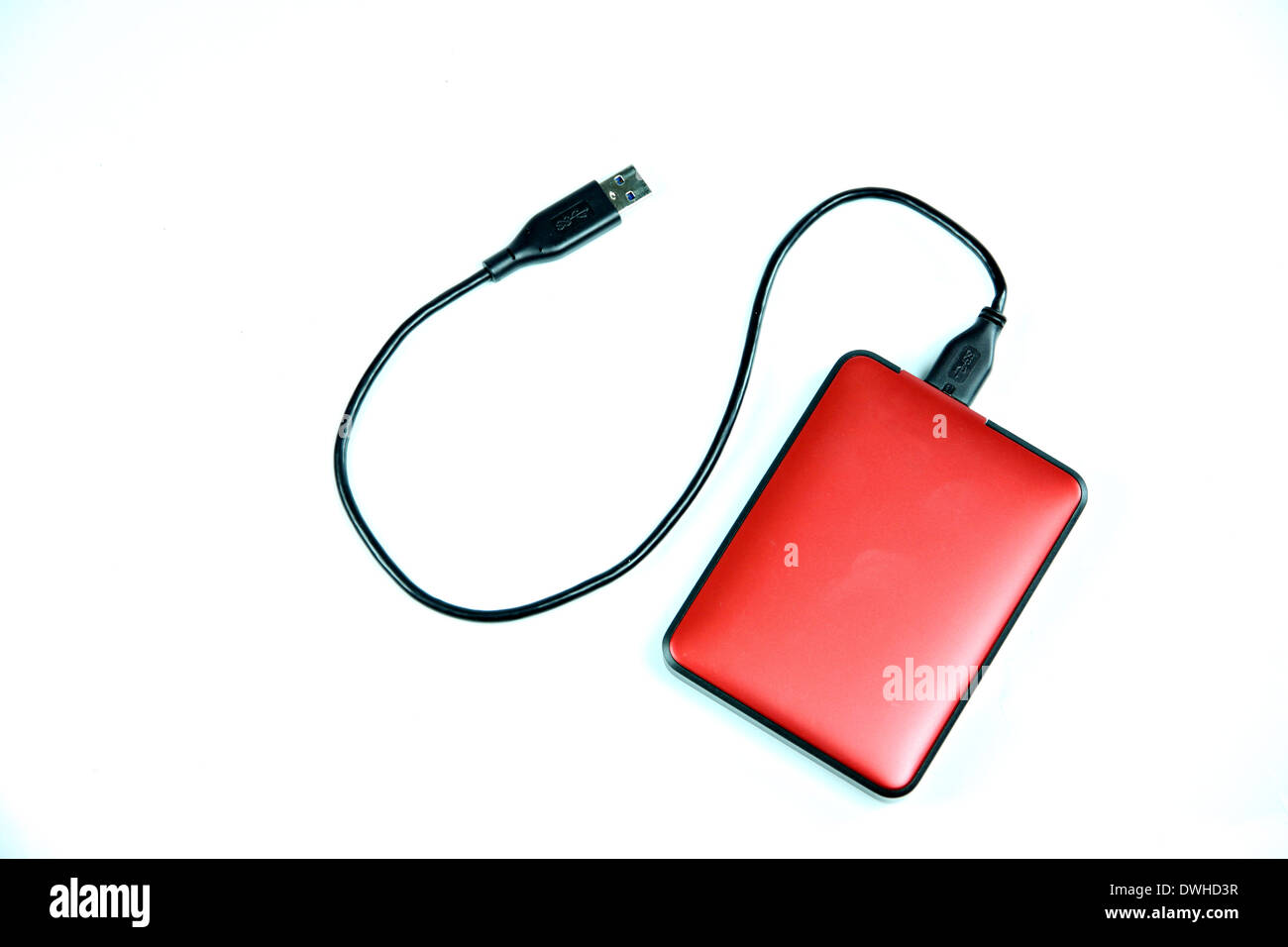 Red external hard disk isolated on white background. Stock Photo
