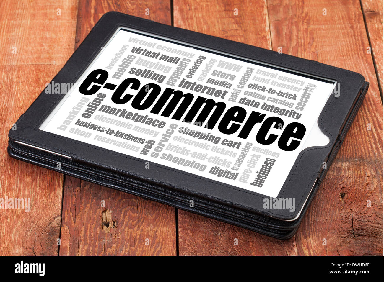e-commerce word cloud - a digital tablet on a rustic wooden table Stock Photo