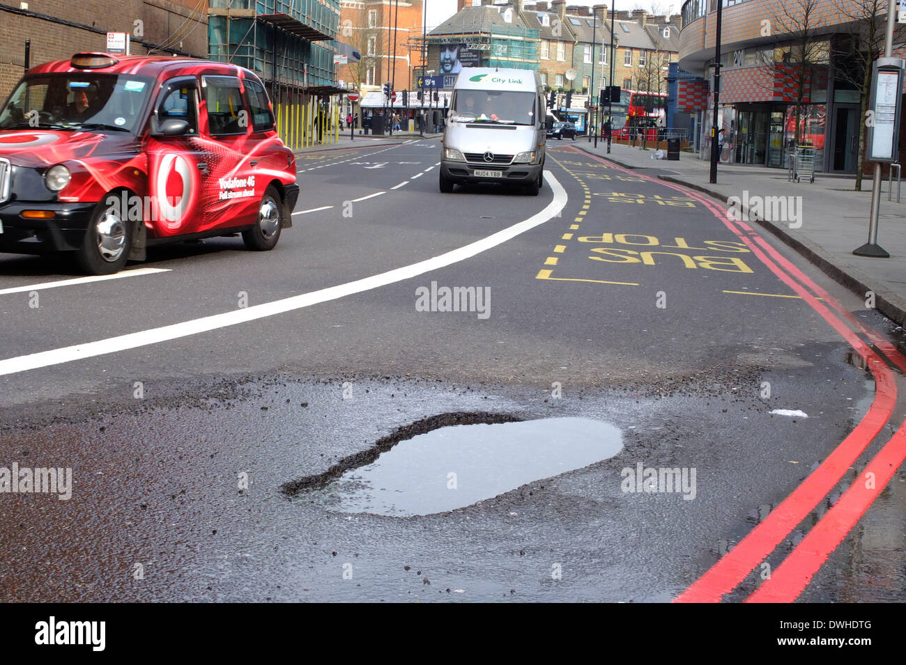 Pothole . . London, UK. 8th March, 2014. A big pothole in the road has