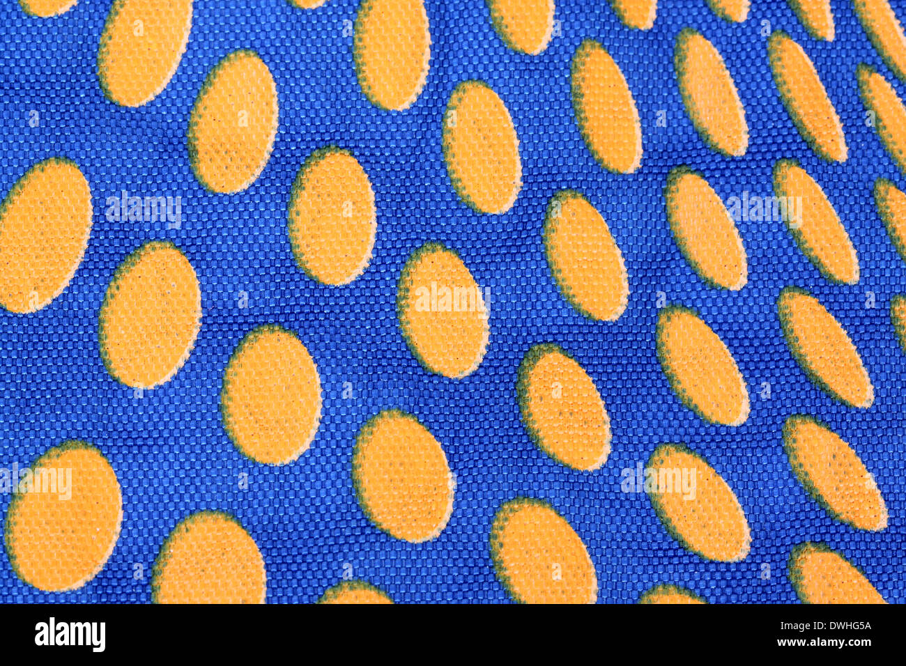 Blue Cloth bag with orange dots for background. Stock Photo