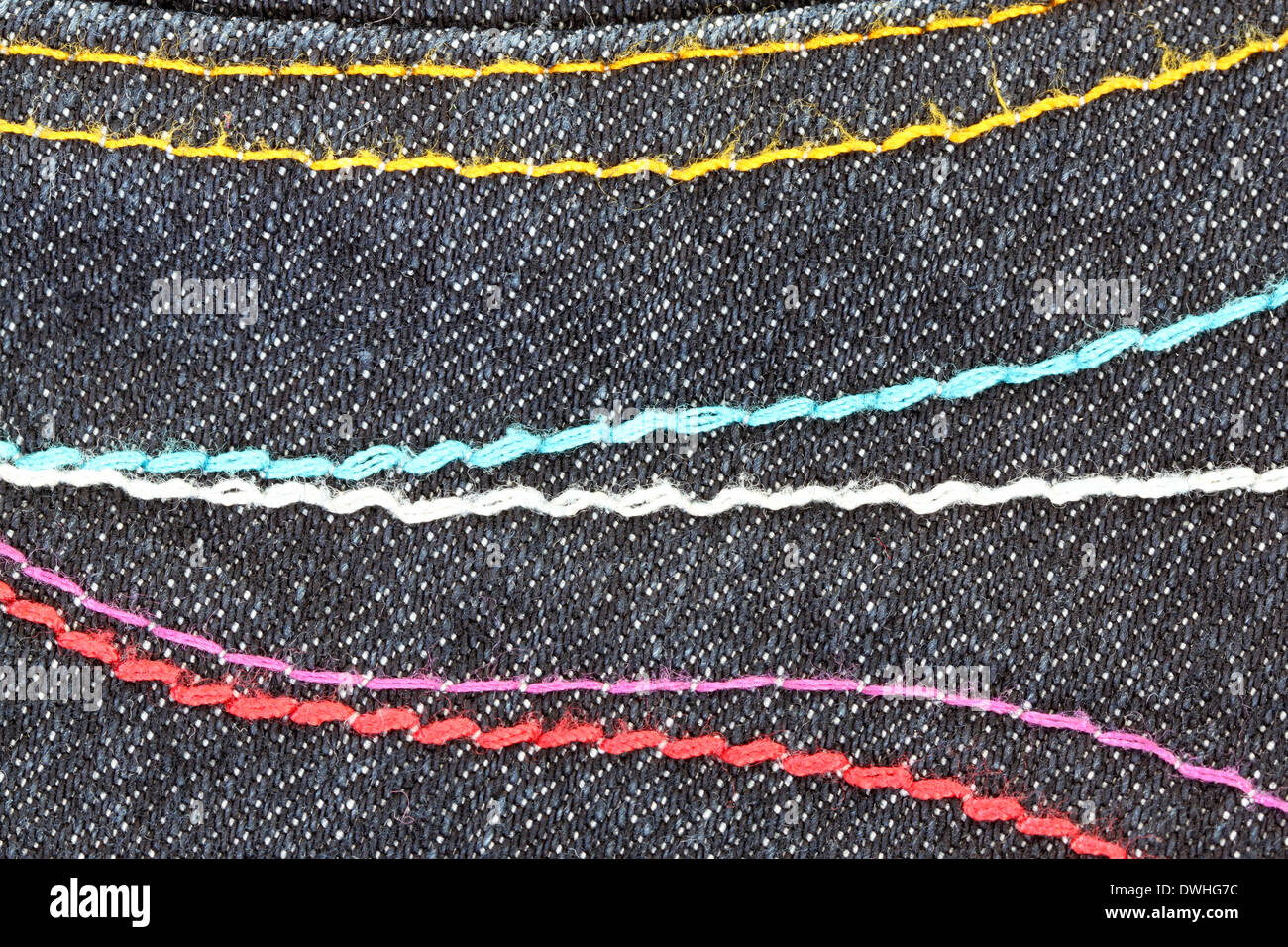 Patterns of yarn on the back of black jeans for background. Stock Photo