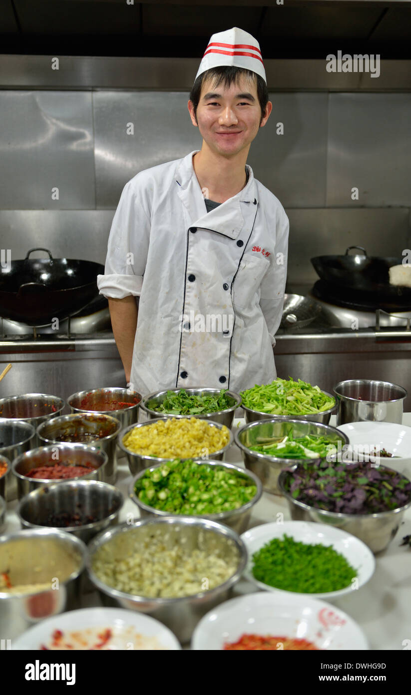 A young cook in a restaurant in Changsha, Hunan province, China. Stock Photo