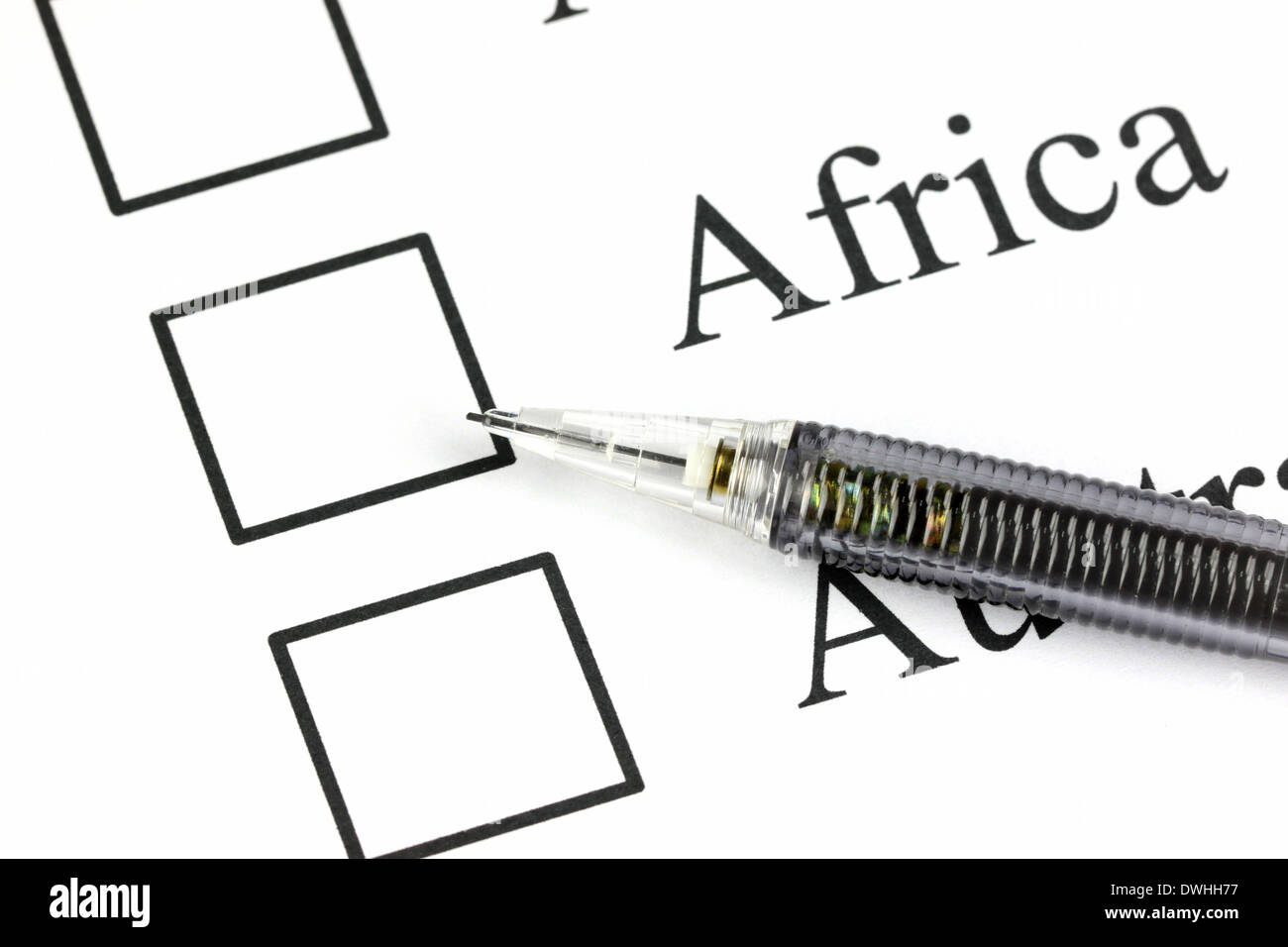 Closeup Mechanical pencil point to Checkbox in Africa text. Stock Photo