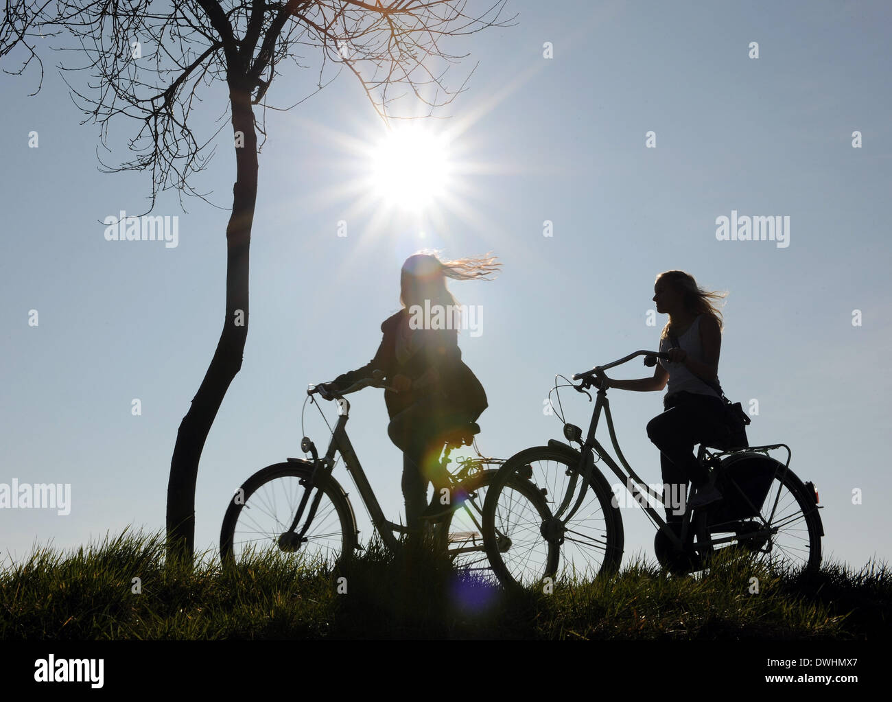 Bruchhausen-Vilsen, Germany. 09th Mar, 2014. Two young cyclists ride on a cycle path in the spring sunshine in Bruchhausen-Vilsen, Germany, 09 March 2014. Photo: INGO WAGNER/dpa/Alamy Live News Stock Photo