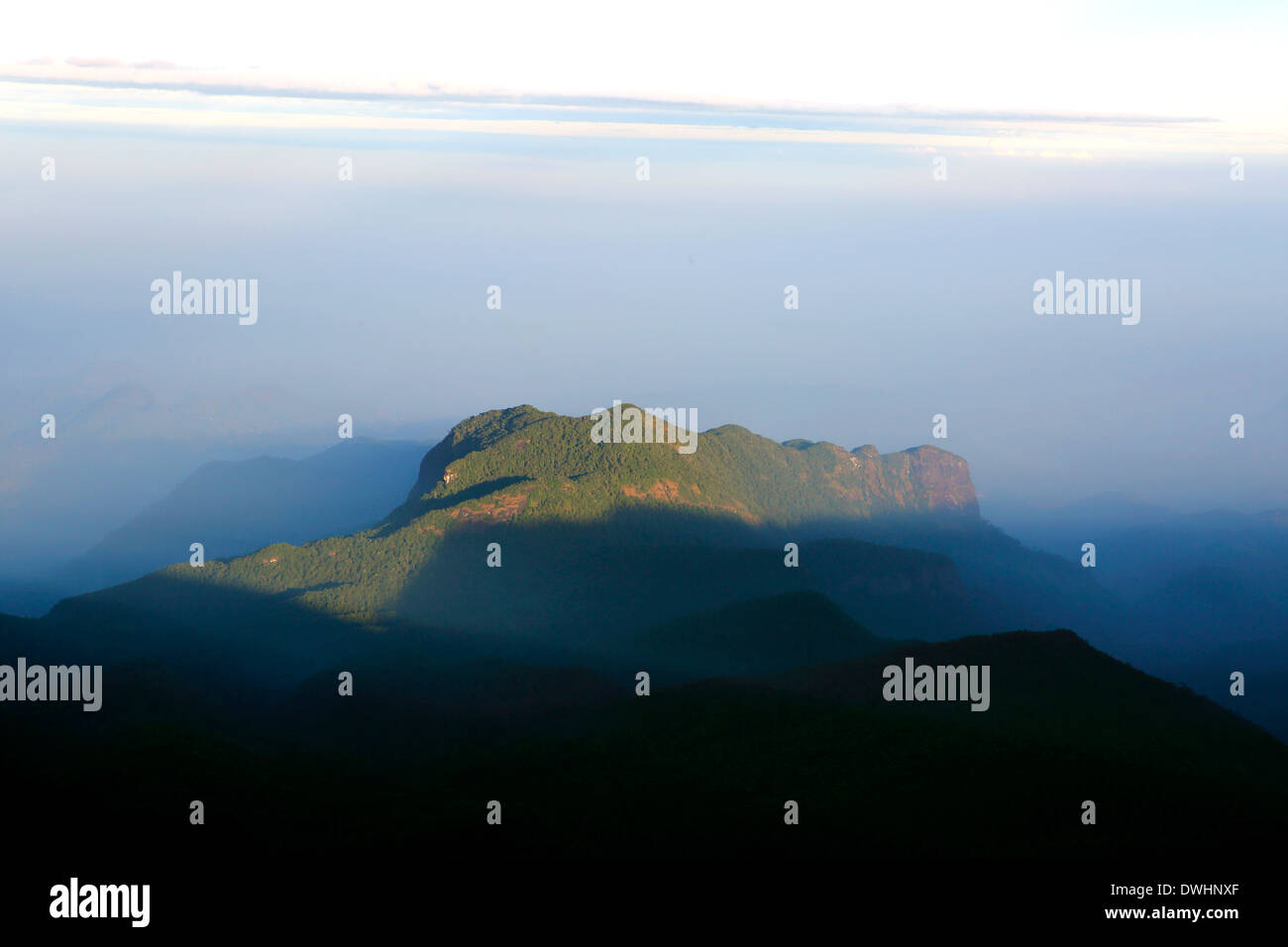 Early morning shadow of Adam's Peak (Sri Pada) cast over surrounding Stock  Photo - Alamy