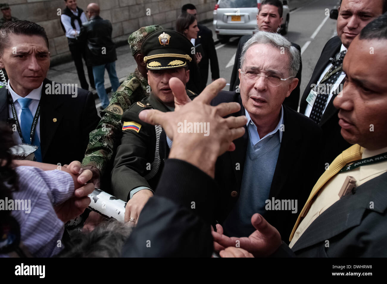 Bogota, Colombia. 9th Mar, 2014. Former Colombian President Alvaro Uribe (2nd R, front) arrives to cast his vote during the parliamentary elections in Bogota, capital of Colombia, on March 9, 2014. Credit:  Jhon Paz/Xinhua/Alamy Live News Stock Photo