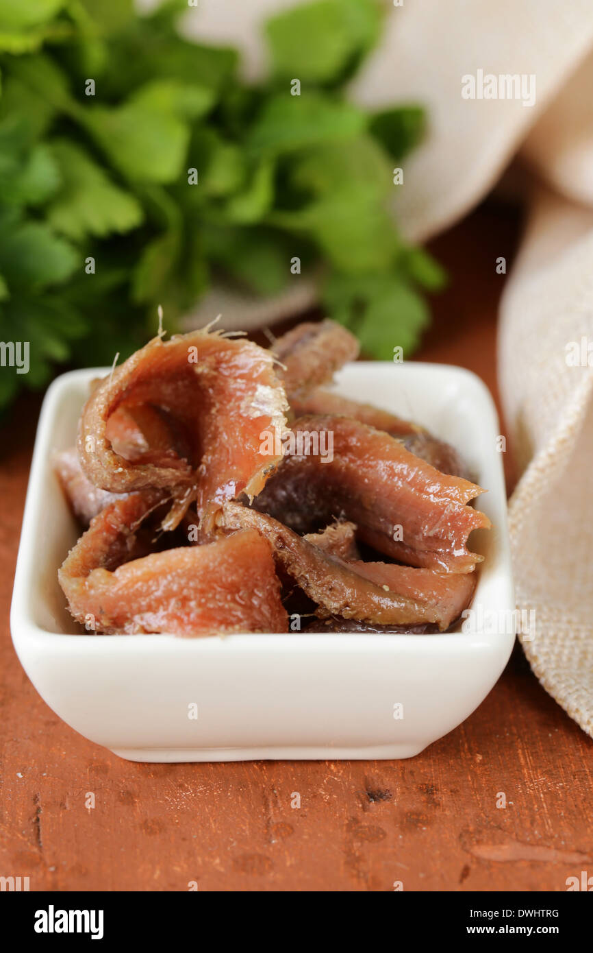 Canned marinated anchovies fillets in a white bowl Stock Photo Alamy