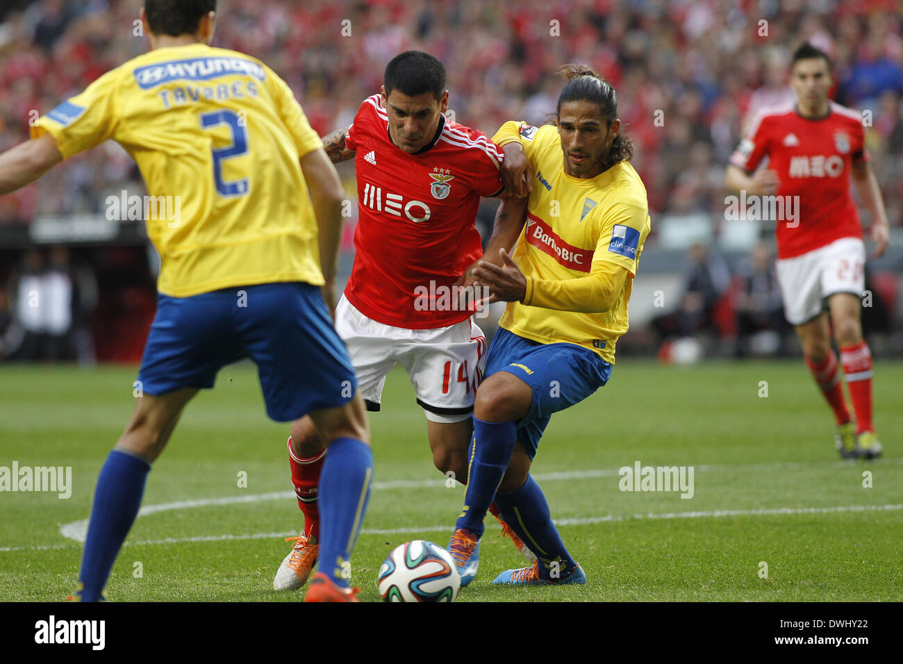 Lisboa, Lisboa, Portugal. 9th Mar, 2014. Benfica's Uruguayan defender Maxi Pereira vies with Estoril's Portuguese defender Tiago Gomes during the Zon Sagres League football match SL Benfica vs Estoril at Luz Stadium in Lisbon. © Filipe Amorim/NurPhoto/ZUMAPRESS.com/Alamy Live News Stock Photo