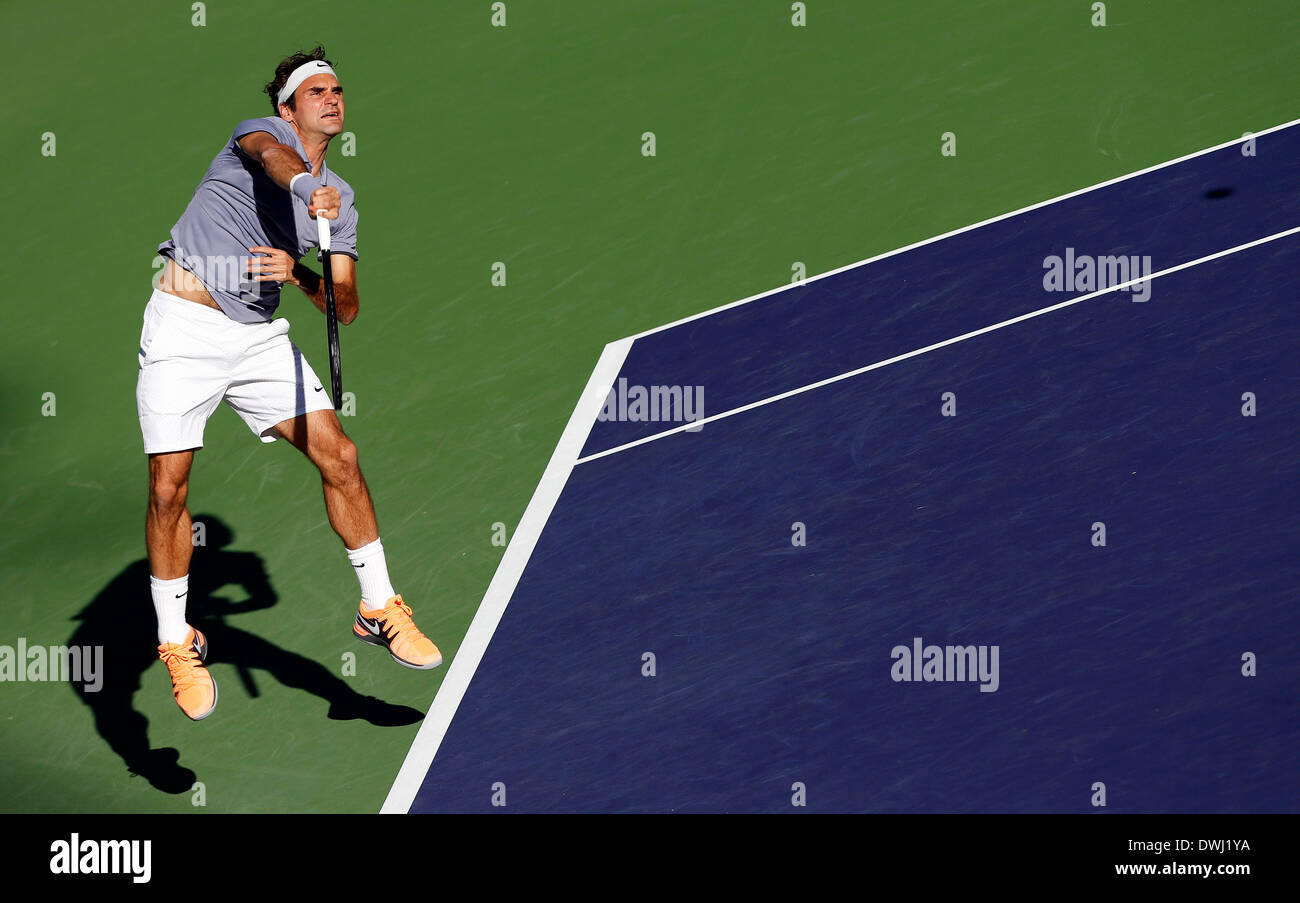 Indian Wells, California, USA. 08 March, 2014: Roger Federer of Switzerland serves to Paul-Henri Mathieu of France during the BNP Paribas Open at Indian Wells Tennis Garden in Indian Wells CA./Alamy Live News Stock Photo