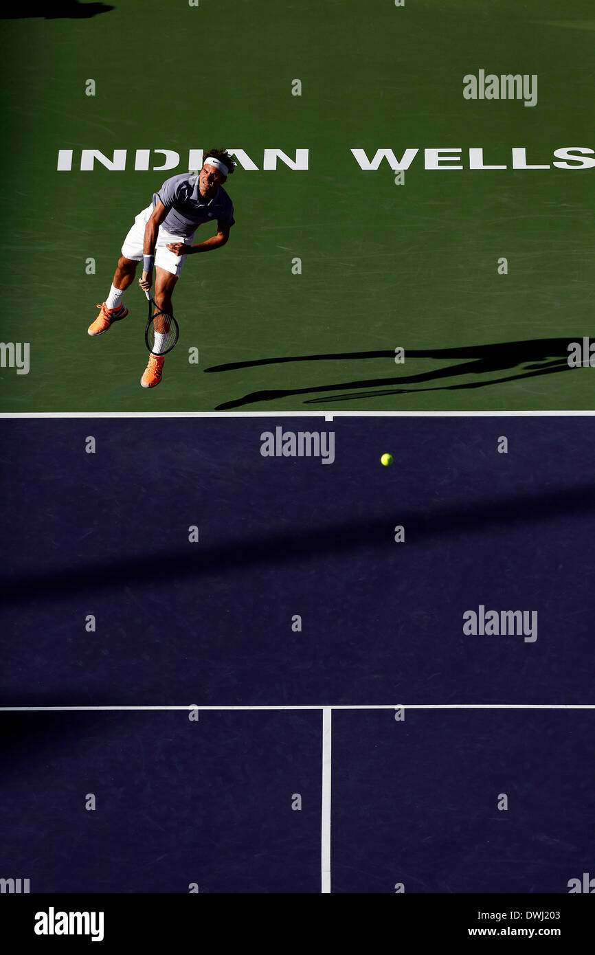 Indian Wells, California, USA. 08 March, 2014: Roger Federer of Switzerland serves to Paul-Henri Mathieu of France during the BNP Paribas Open at Indian Wells Tennis Garden in Indian Wells CA./Alamy Live News Stock Photo