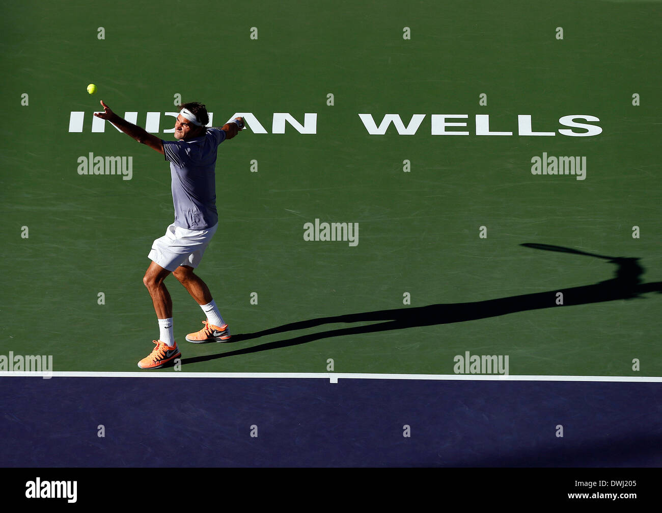 Indian Wells, California, USA. 08 March, 2014: Roger Federer of Switzerland serves to Paul-Henri Mathieu of France during the BNP Paribas Open at Indian Wells Tennis Garden in Indian Wells CA./Alamy Live News Stock Photo
